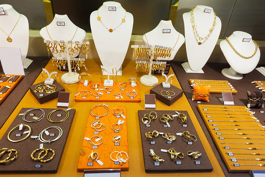 A collection of gold jewelry showcased in an Indian jewelry store. Gold jewelry which is charged with GST rates in India. 