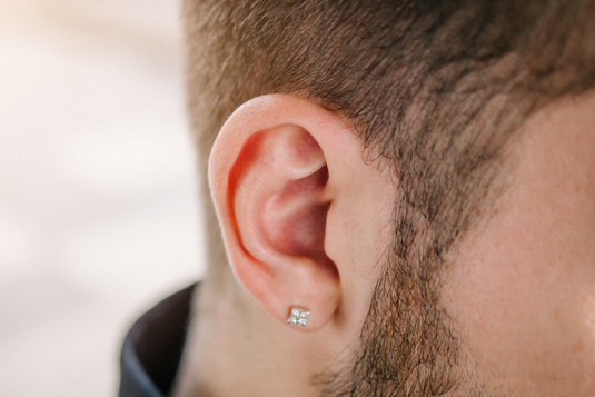 Men ear piercing